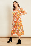 Ladies orange floral dress with puffed sleeves